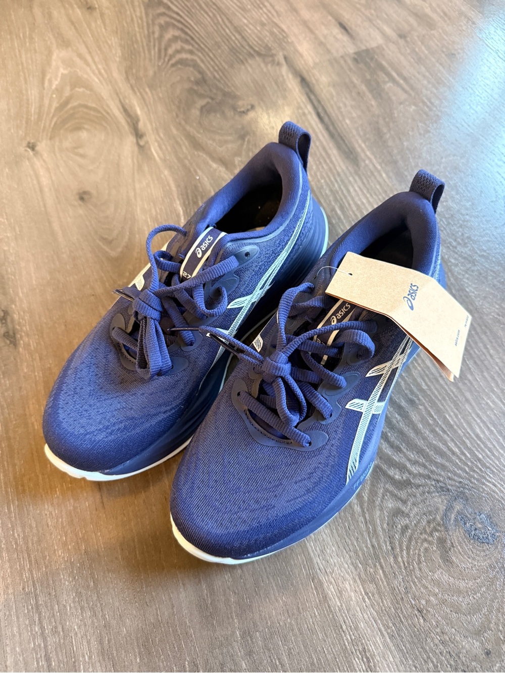 ASICS women’s Navy and White Athletic Running Shoes